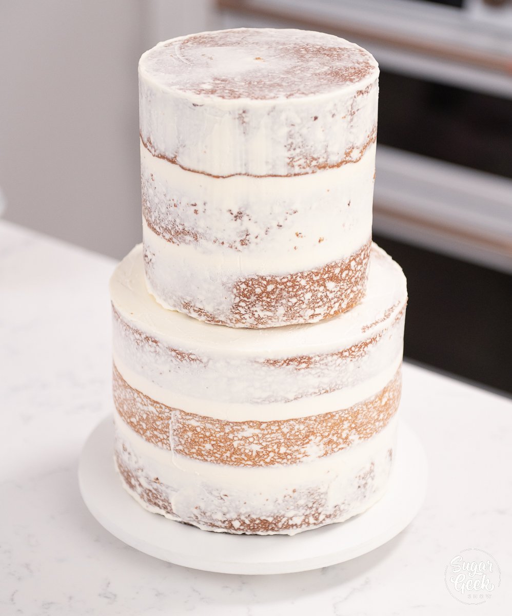 naked wedding cake on cake plate