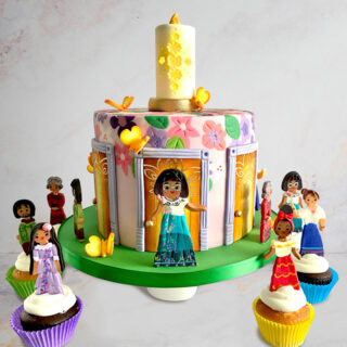 Cake decorated to look like the Encanto house and cupcake toppers