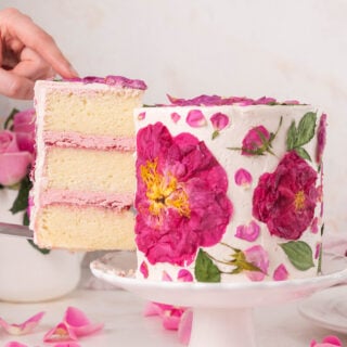 Photo of a rose cake with a slice coming out