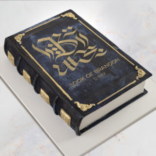 Cake sculpted to look like an ornate book