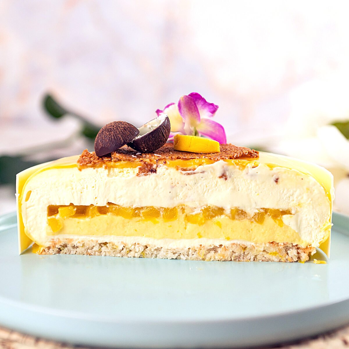 mango mousse cake cut in half