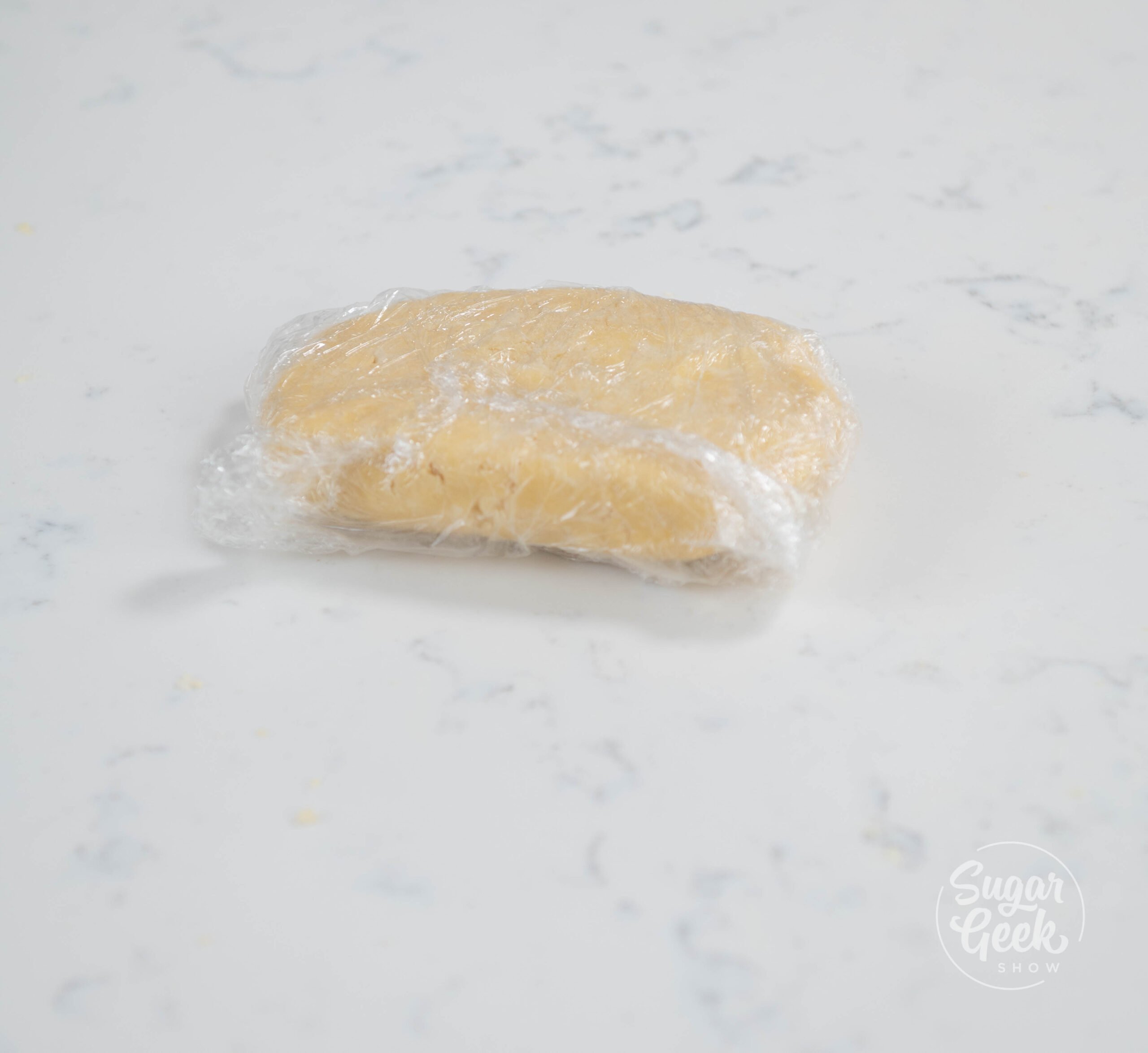 dough wrapped in plastic wrap