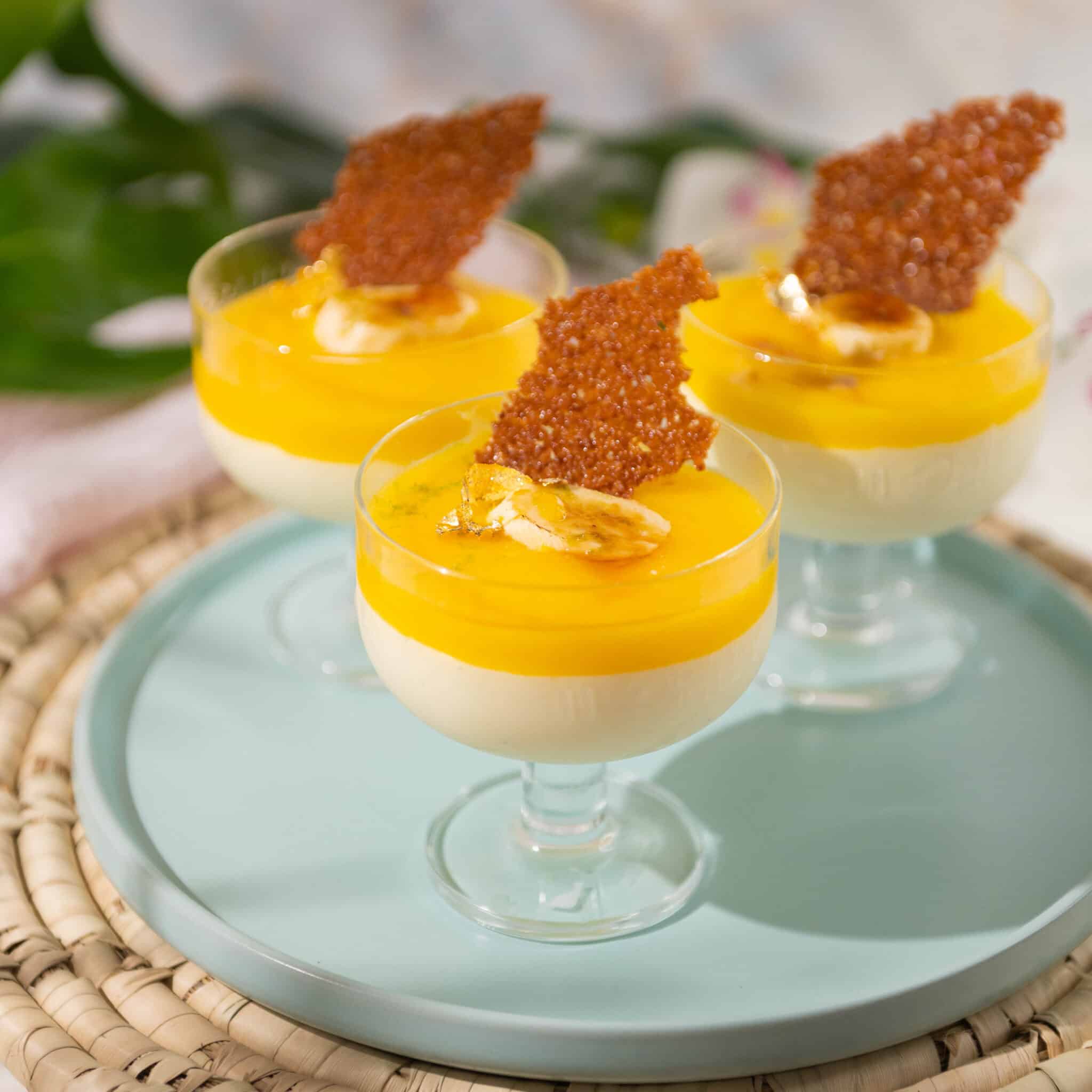 3 cups filled with coconut mousse and mango puree
