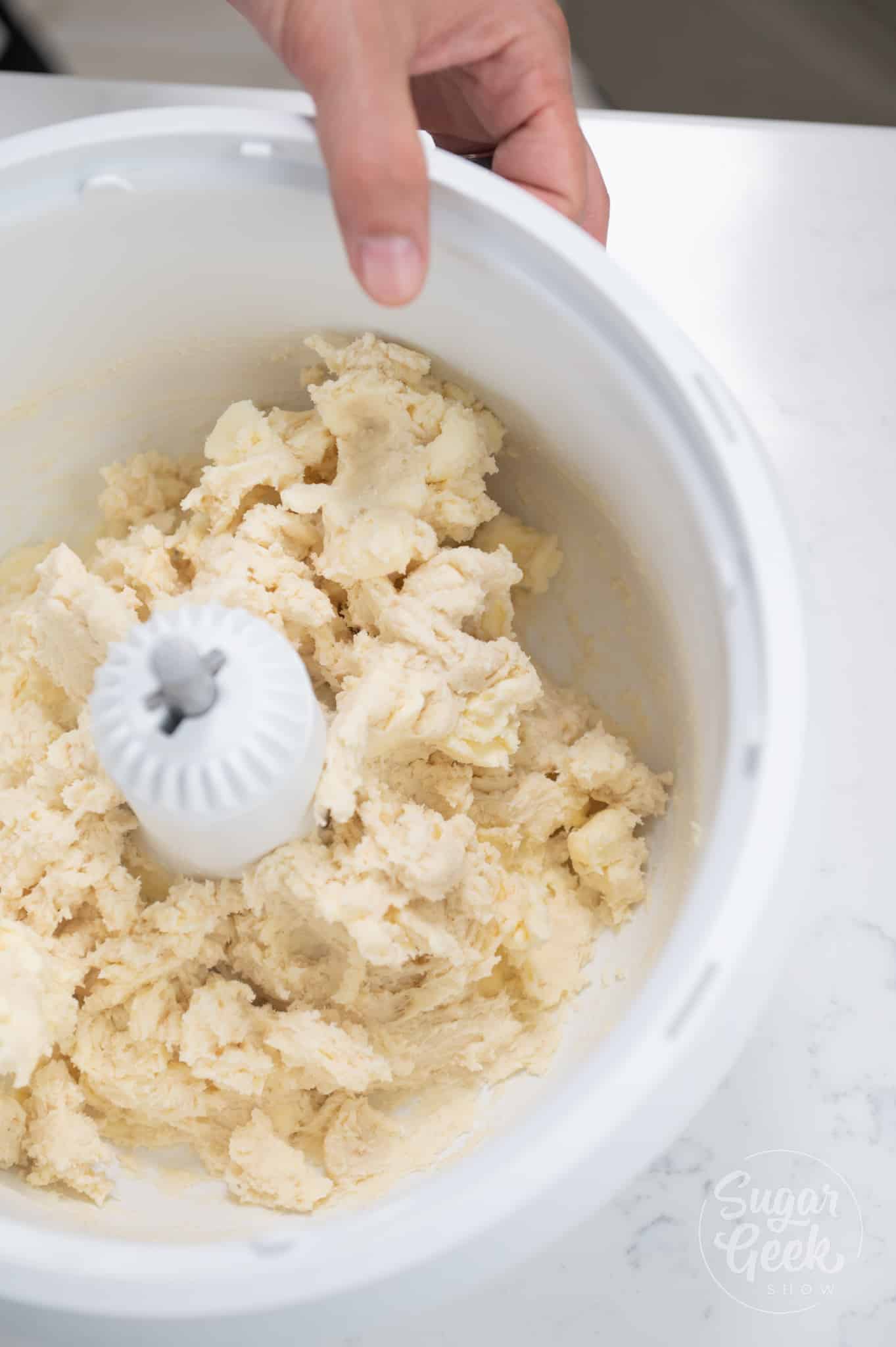 picture of dough mixed inside stand mixer.