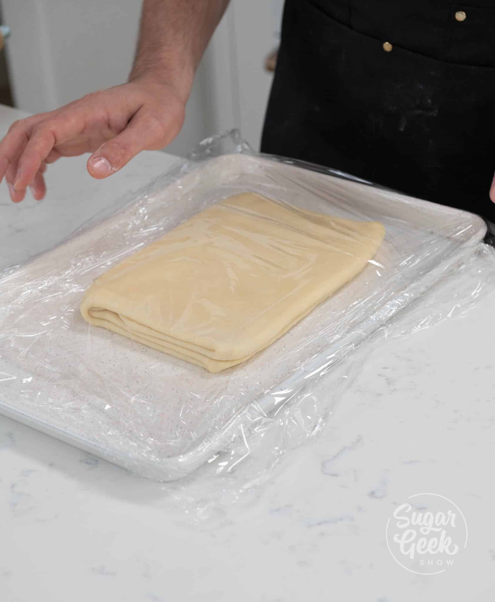 dough resting on baking sheet.