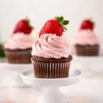 strawberry buttercream on a chocolate cupcake