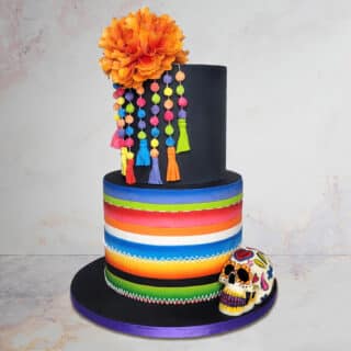 Cake decorated to look like dia de los muertos