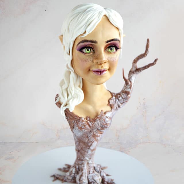 cake sculpted to look like a bust portrait of the Virgo astrological sign