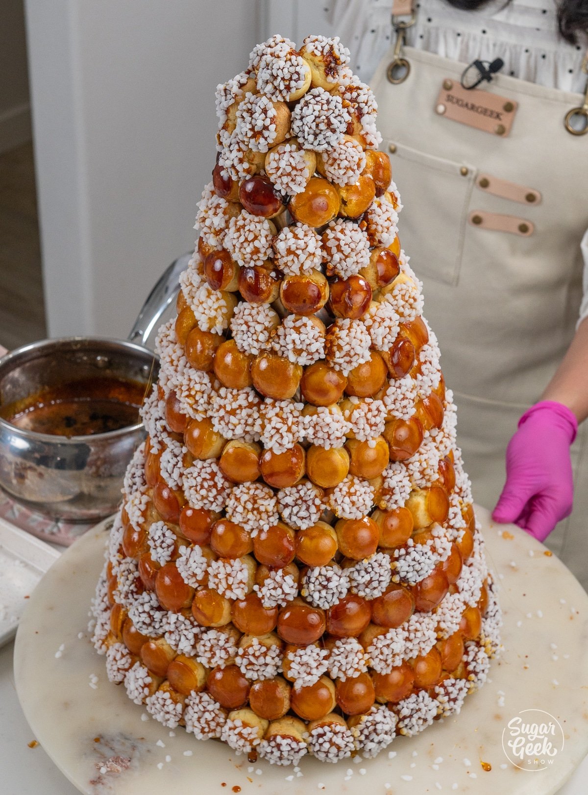 croquembouche of white and brown cream puffs organized in a pattern