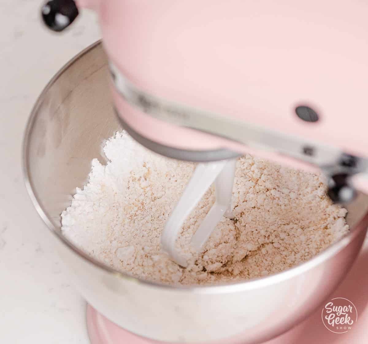 mixing powdered sugar and almond flour in a stand mixer. 