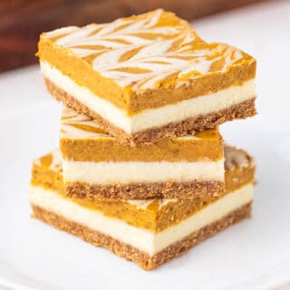 close up of pumpkin cheesecake bars on a plate