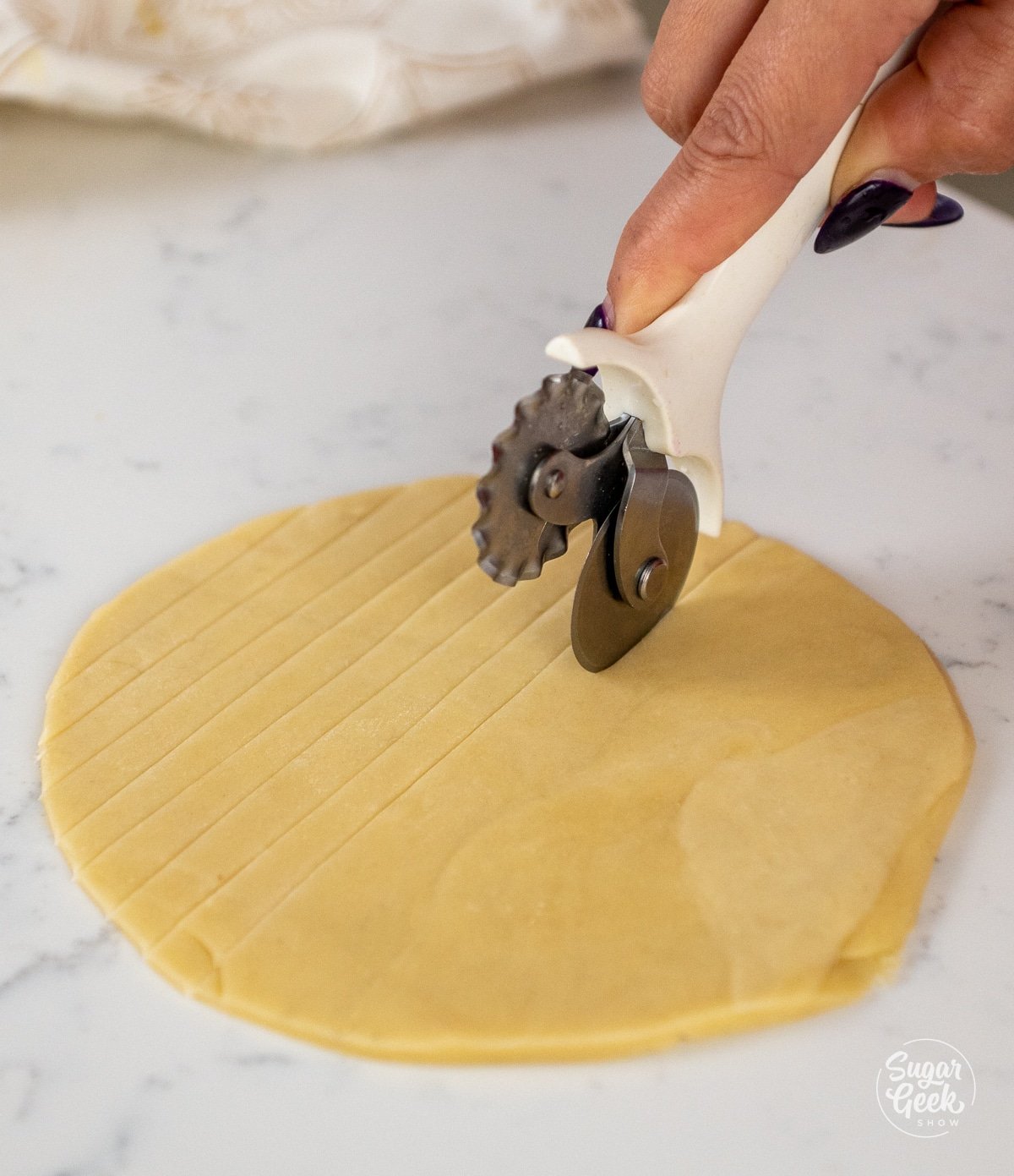 hand cutting pie dough into 1/4" strips. 