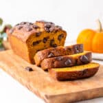 pumpkin chocolate chip loaf slices on a wooden cutting board