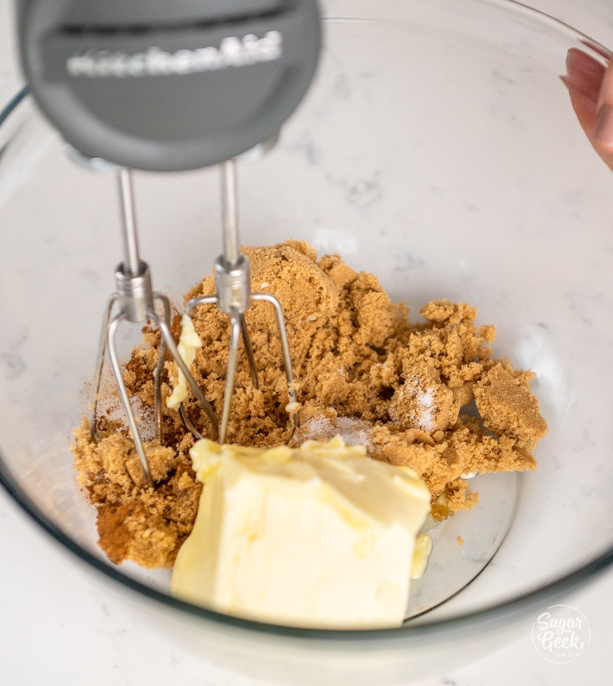 electric hand mixer combining a butter mixture