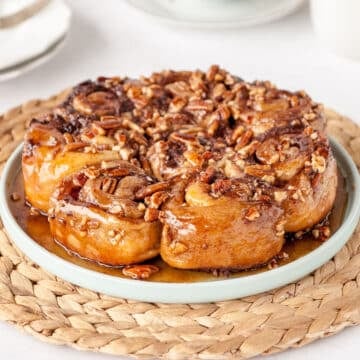 close up of sticky buns on a blue plate