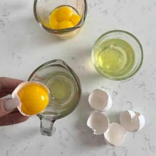 hand separating eggs from above