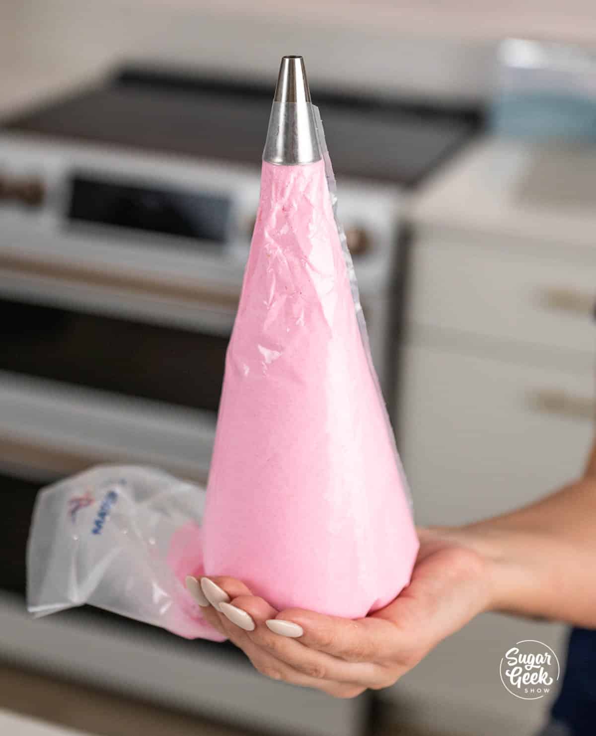macaron batter in a piping bag