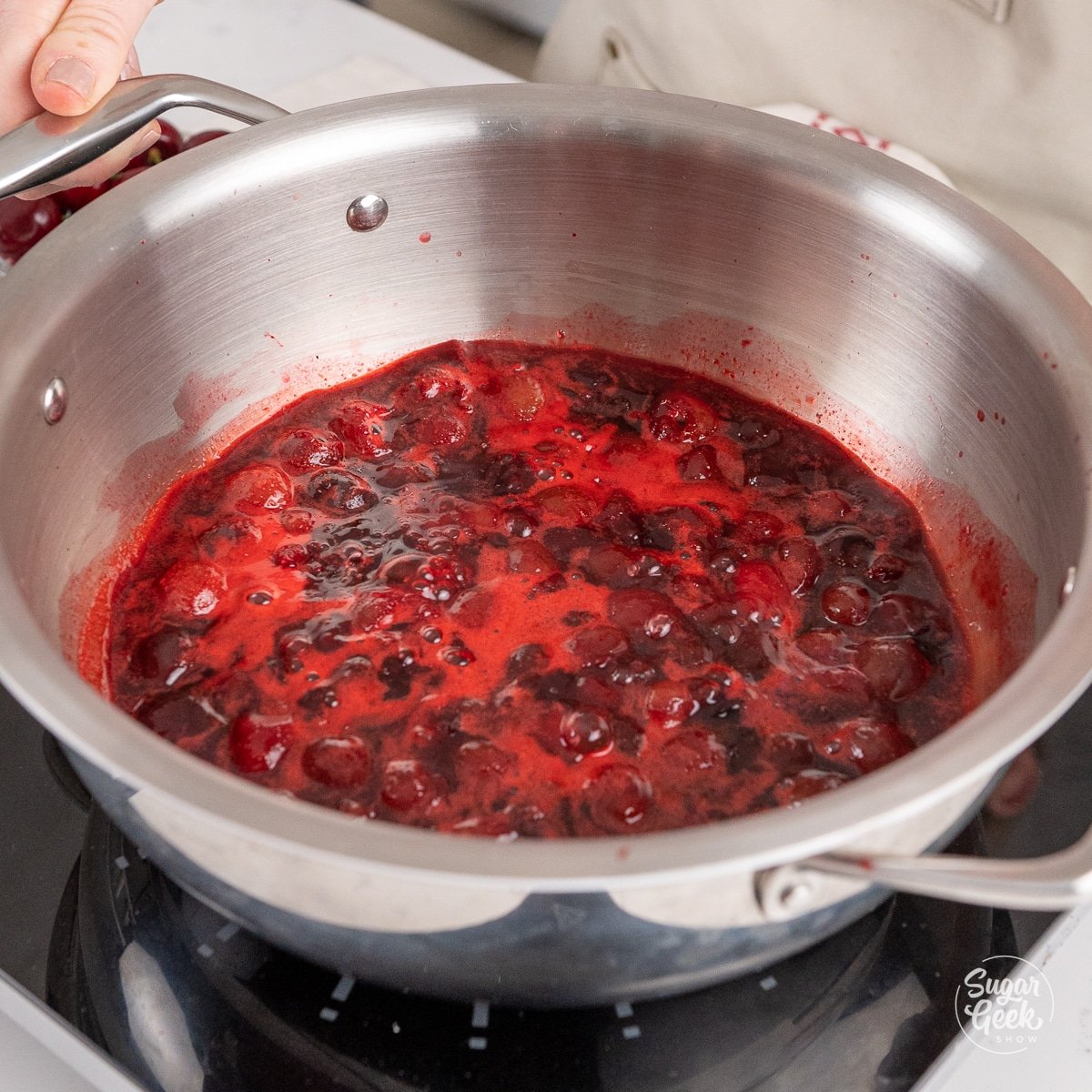 pan of cherries jubilee on a stove