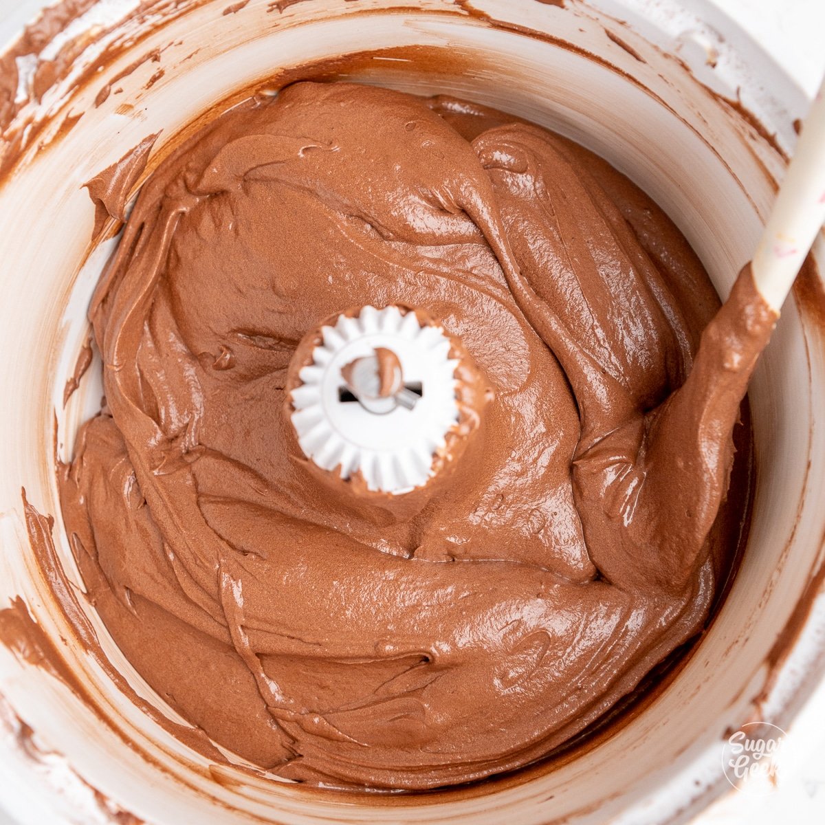 stand mixer bowl filled with creamy chocolate cake batter
