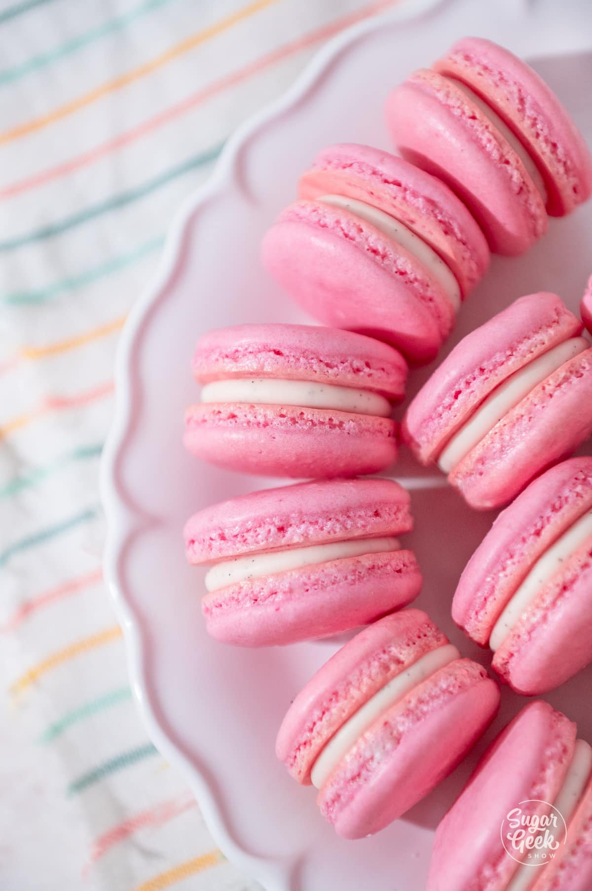plate of pink macarons lined up in a circle