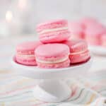 pink macarons stacked on a plate