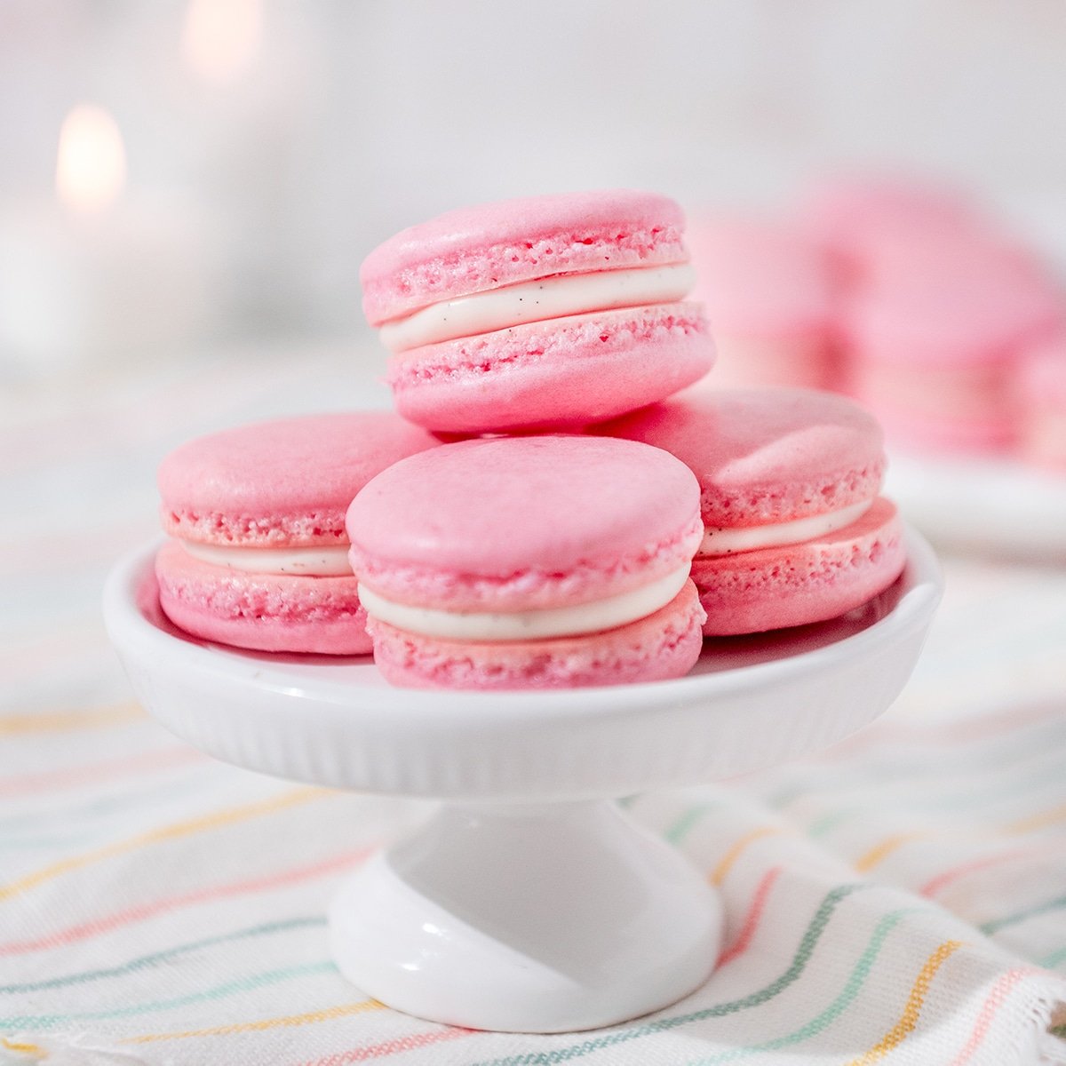 pink macarons stacked on a plate