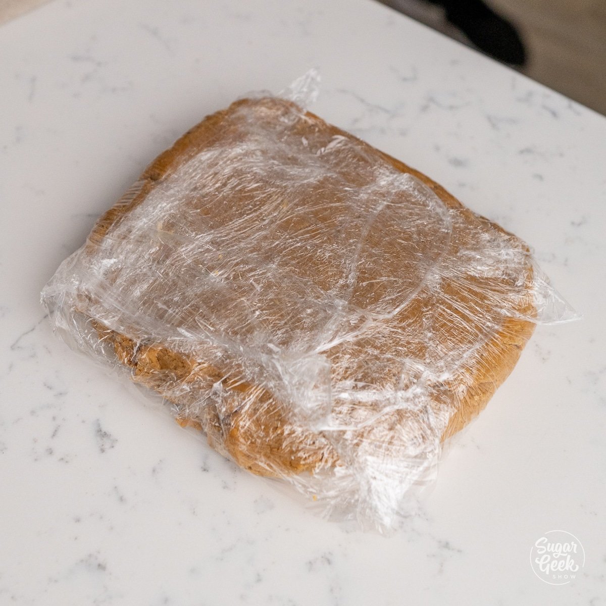 cookie dough wrapped in plastic on a table