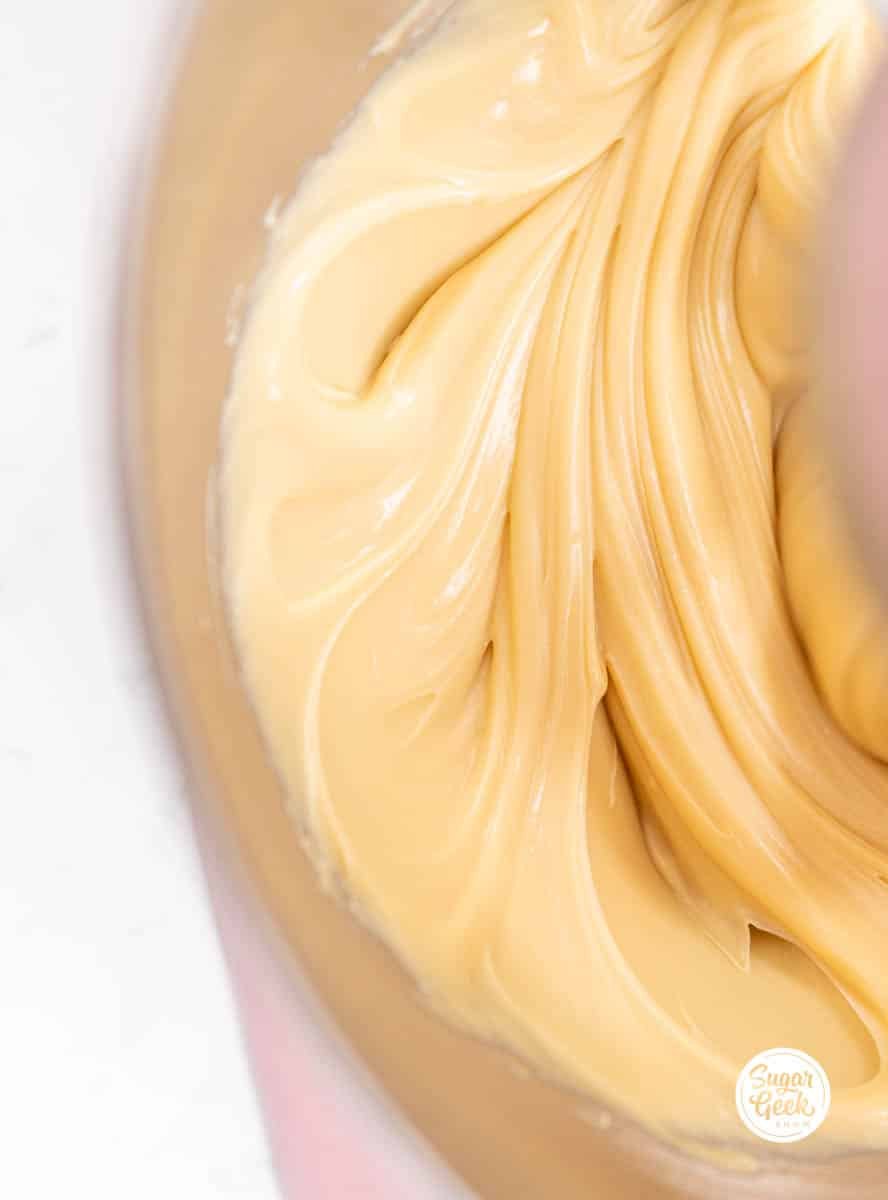 smooth white chocolate ganache in a stand mixer