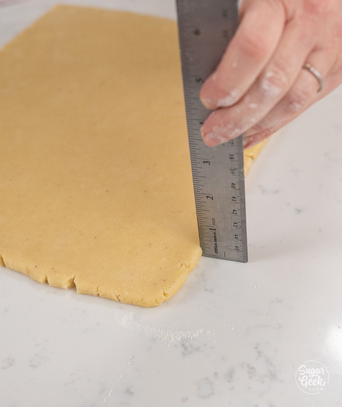 Ruler places along dough to show 1/4 inch.