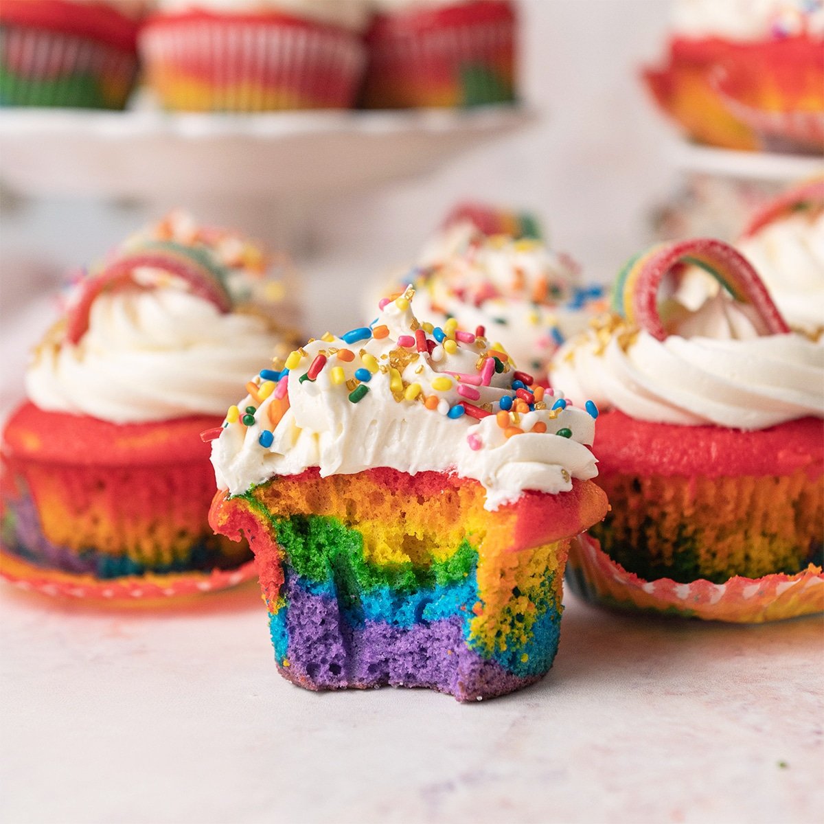 rainbow cupcake with a bite taken out of it