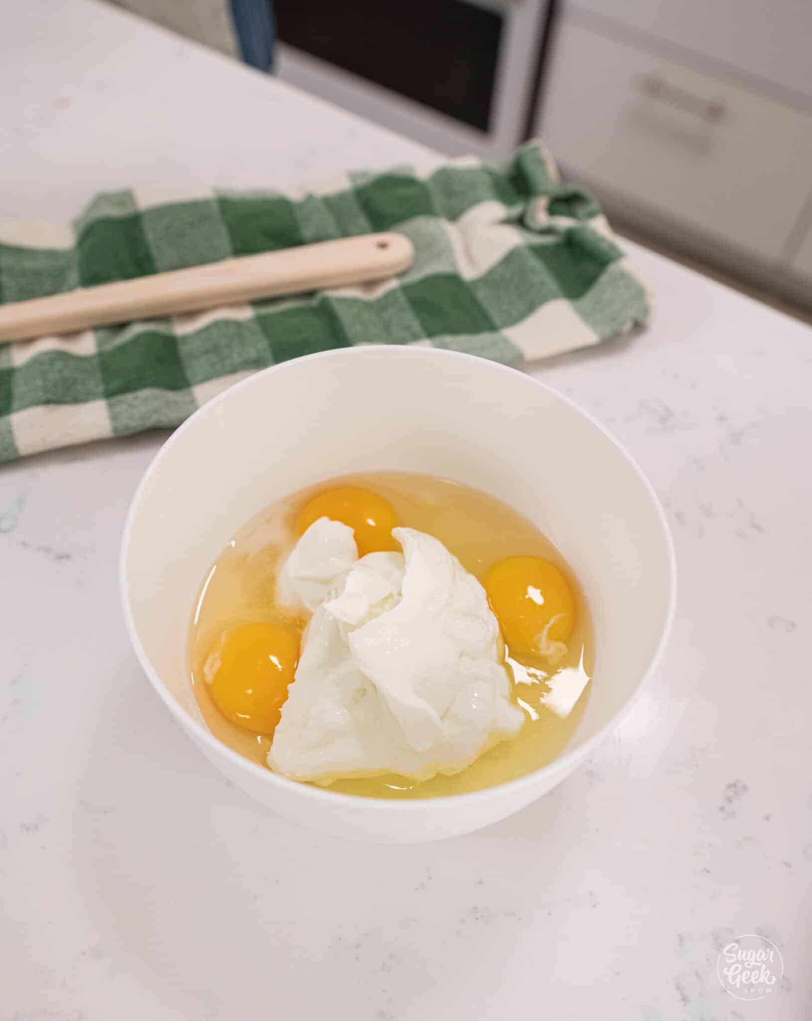 eggs and sour cream in a white bowl