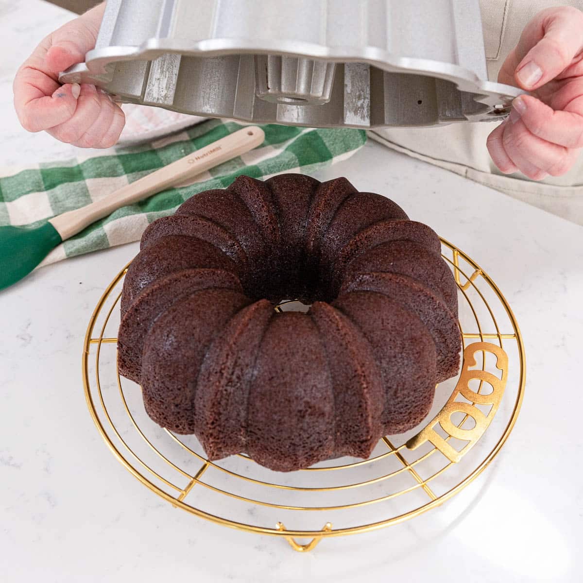 unmolding guinness cake onto a cooling rack