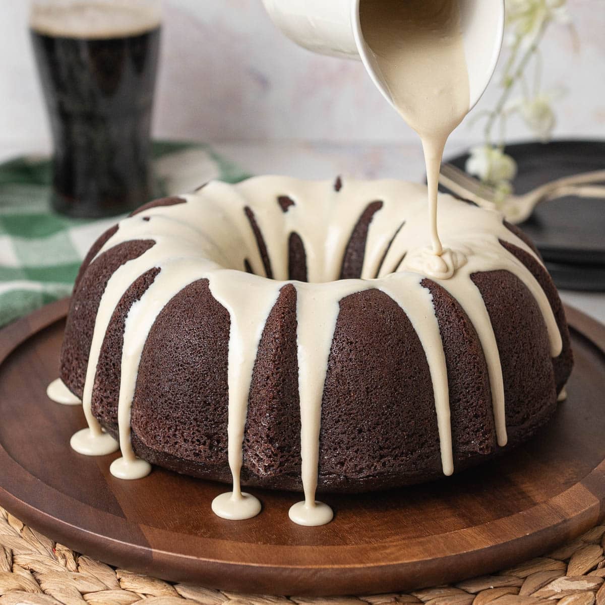 drizzling Guinness ganache over the Guinness bundt cake