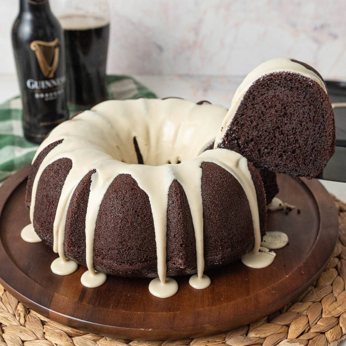 Close up of a slice of Guinness cake being cut from the finished bundt cake