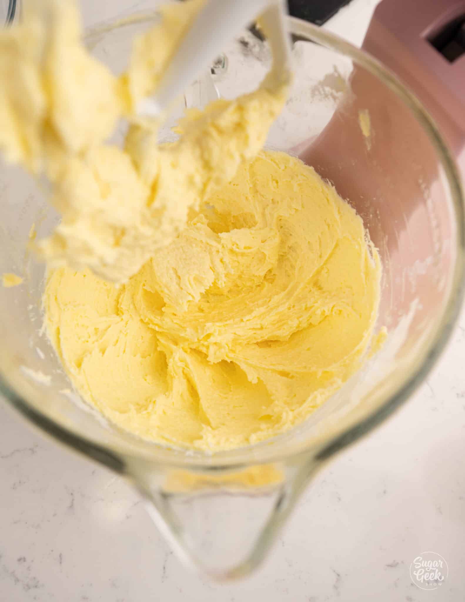 creamy butter and sugar mixture in a glass stand mixer bowl