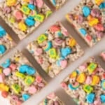 lucky charms rice krispie treats lined up on a table