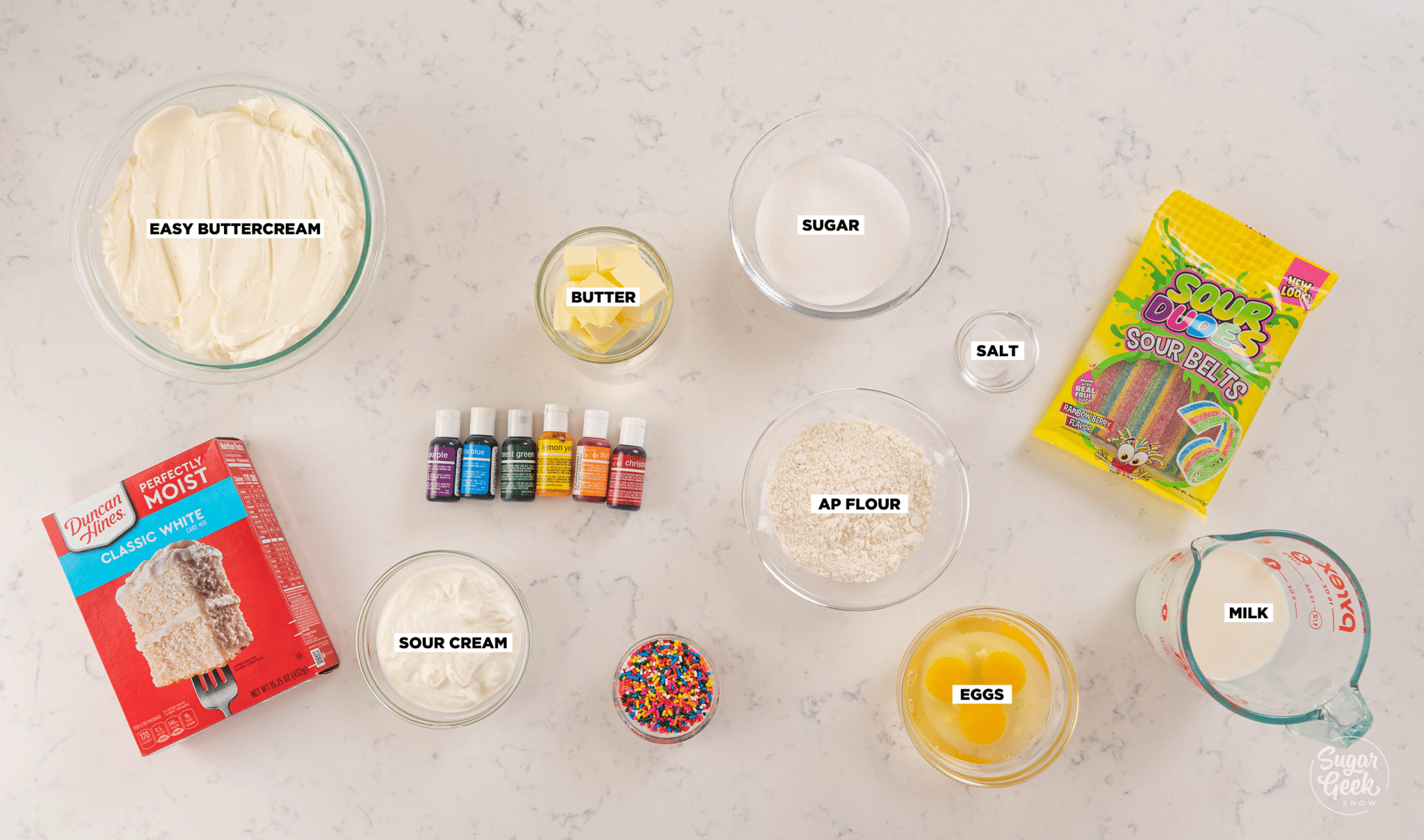 ingredients for rainbow cupcakes in bowls