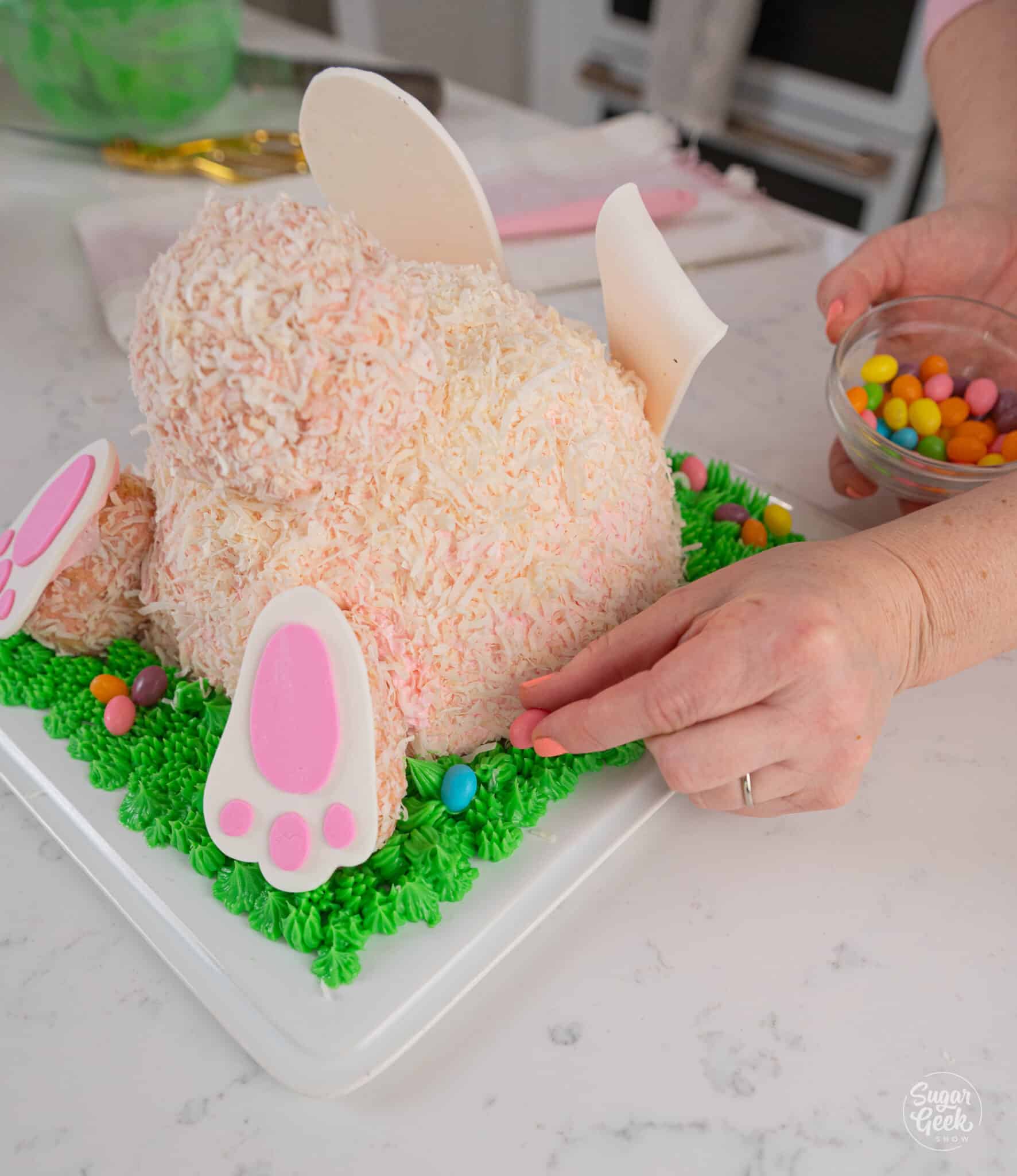 adding jelly beans to a bunny butt cake
