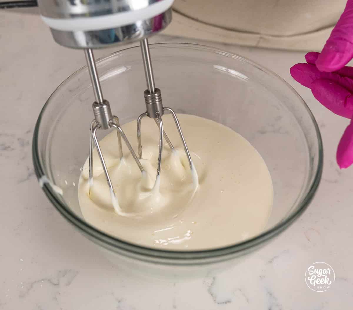 blending a bowl of heavy whipping cream
