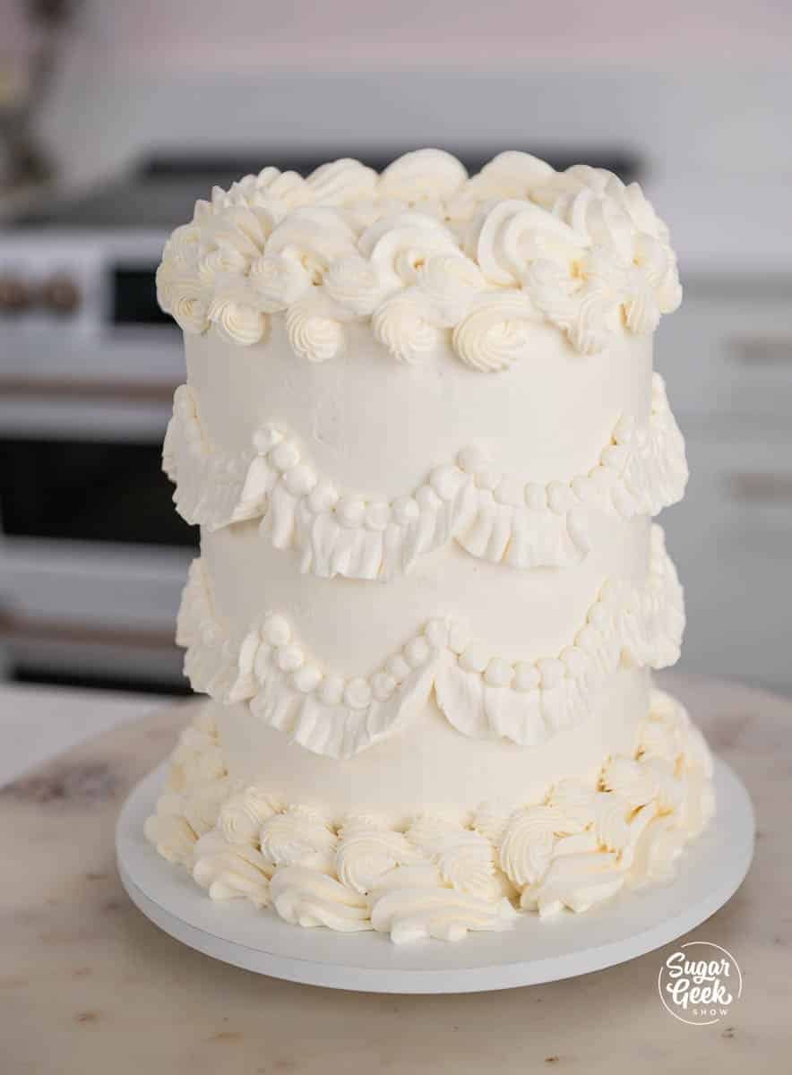 buttercream details piped on a white cake