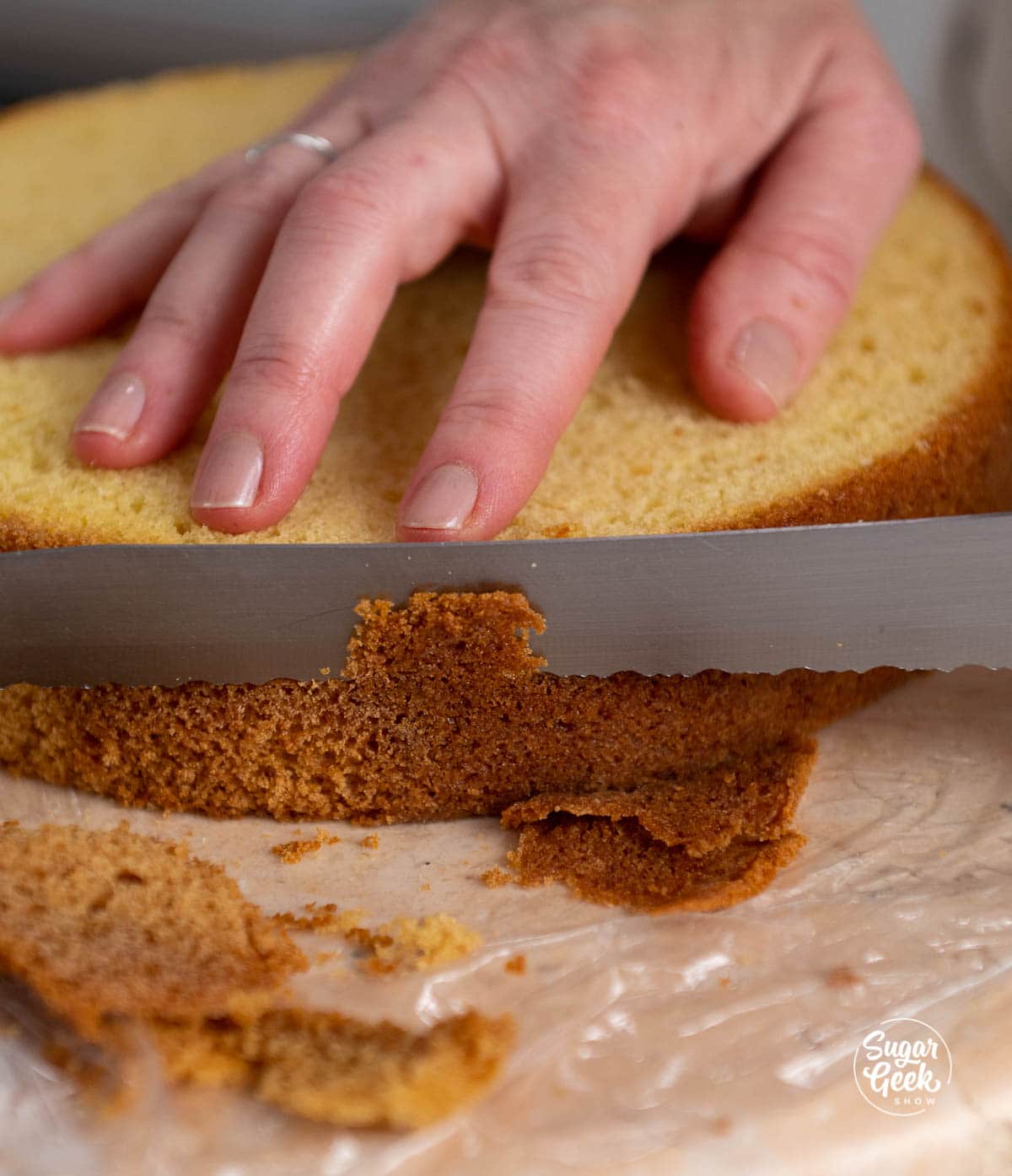 trimming the brown edges off of a cake