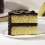 slice of yellow cake with chocolate frosting