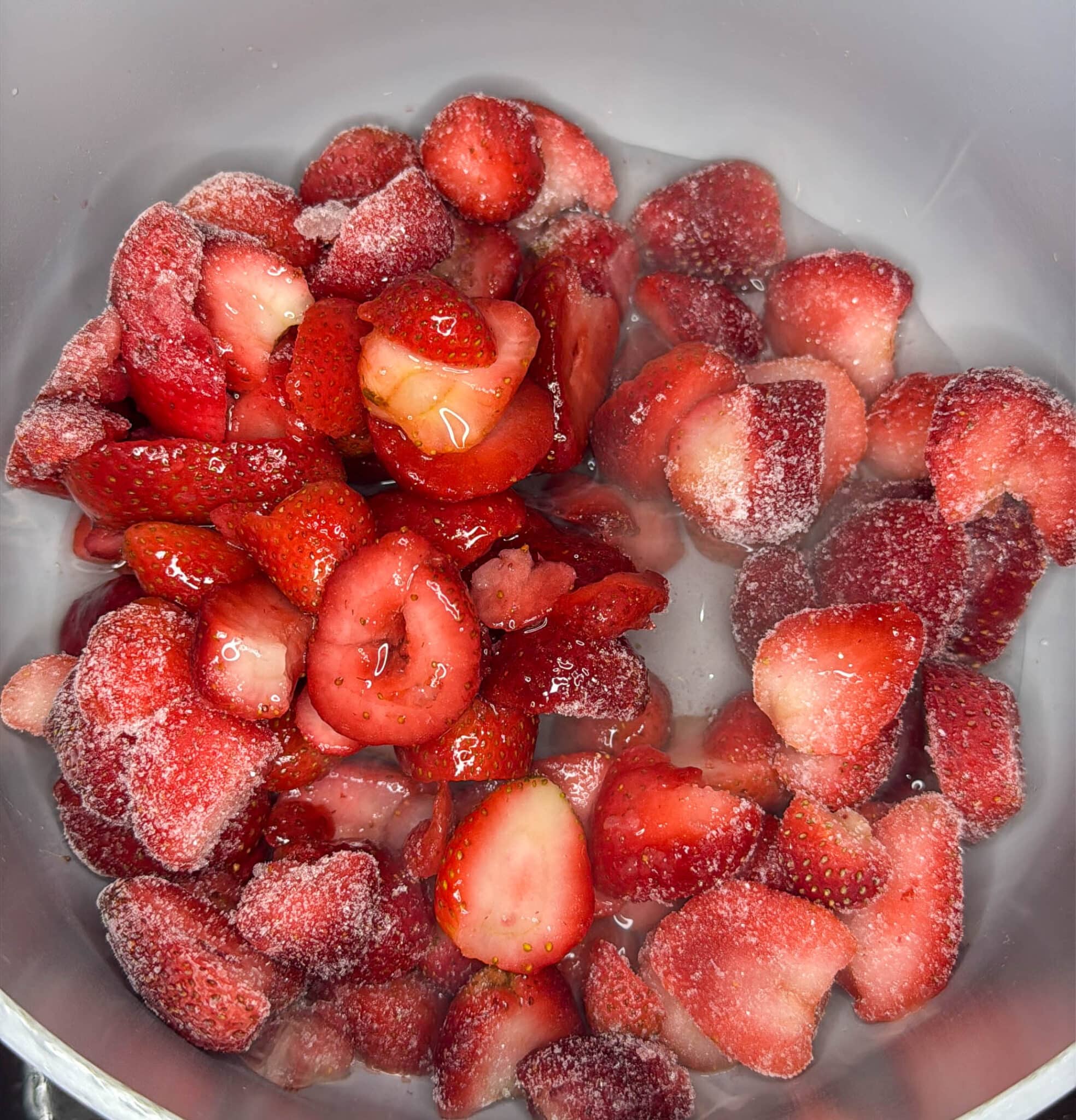 frozen berries in a saucepan shot from above