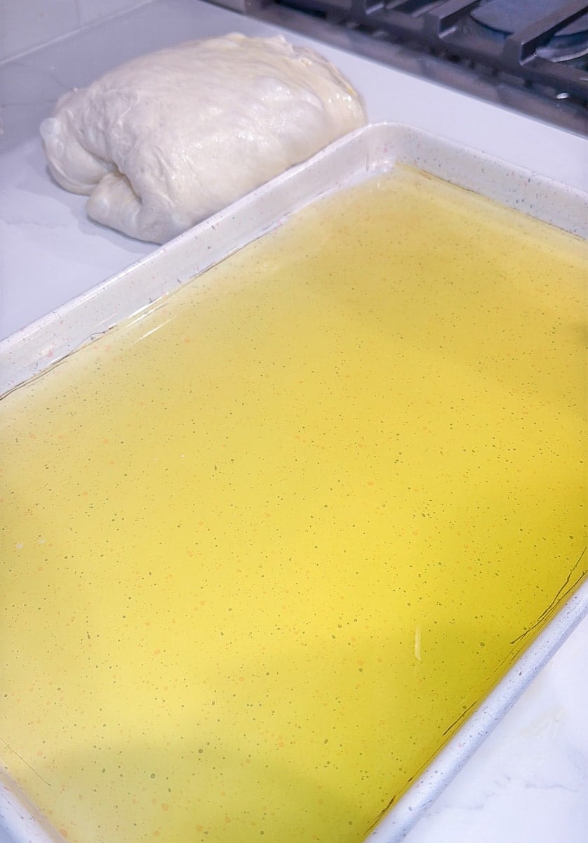 Thin layer of olive oil in a sheet pan.