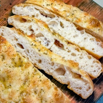 sliced focaccia on a wooden board