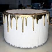 gold drip on a white cake