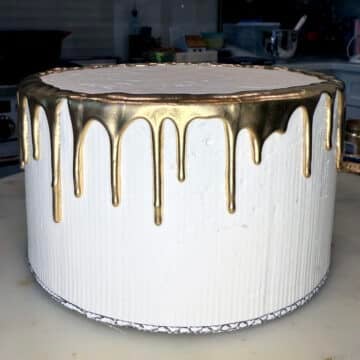 gold drip on a white cake