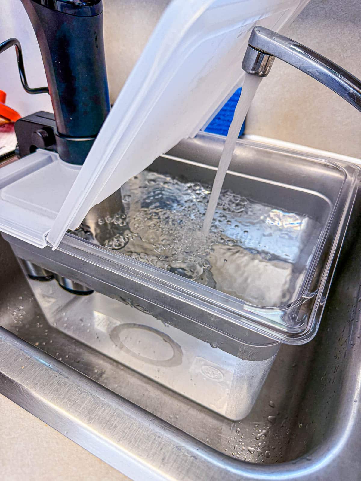 filling a sous vide container with water