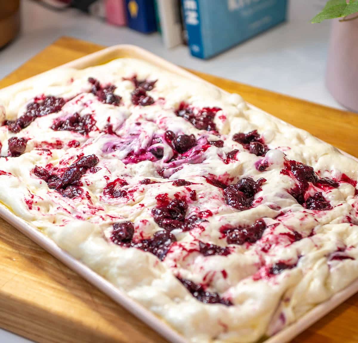 lemon blueberry sourdough focaccia on a pan unbaked