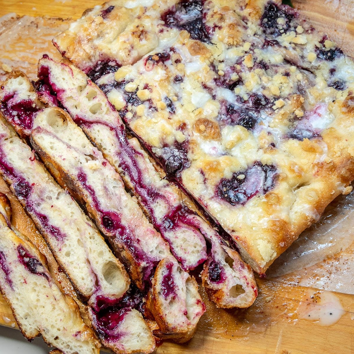 close up of sliced lemon blueberry sourdough focaccia